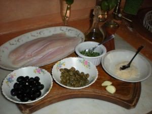 Filetti di pangasio al forno con olive e capperi