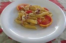 Penne con calamari, pomodorini e arancia